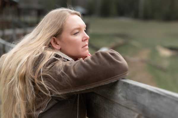 When Things Go Wrong on the Homestead_1 A woman gazing out over a fence.